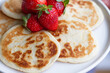 © Leire Gamboa/ADDICTIVE STOCK - Closeup of homemade pancakes with fresh strawberries served on plate on table for healthy breakfast