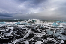 Spectacular View Of Storming Sea With Icebergs Under Cloudy Sky In Winter In Iceland