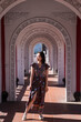 © Juan Alberto Ruiz/ADDICTIVE STOCK - Asian female tourist in dress standing in arched passage of Cikang Overpass bridge and looking away during holiday in Taiwan