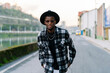 © Luis Manuel Munoz/ADDICTIVE STOCK - Young African American male in trendy wear and chain looking at camera on urban asphalt roadway
