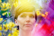 © Marianna Jaszczuk/ADDICTIVE STOCK - Crop pensive adult female with short hair recreating in green garden near bright colorful blossoming flowers and looking away