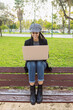 © Marina Gallardo/ADDICTIVE STOCK - Positive ethnic female student sitting on bench and typing on laptop while working on assignment in university campus