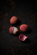 © Mikel Ponce/ADDICTIVE STOCK - Top view of lychee on dark rustic wooden background