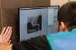 © Xavier Lorenzo/ADDICTIVE STOCK - Back view of crop anonymous veterinarian looking at monitor with x ray of paw of dog in vet clinic