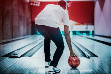 African American bowling at a hall