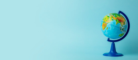 earth globe on clean blue banner background. education, school, study and knowledge background conce