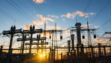 power line pylons during sunset with beautiful saturated sky. distribution transmission and consumption of electricity