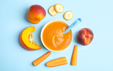 Wall Mural - Flat lay composition with healthy baby food and ingredients on light blue background