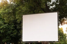 Open Air Cinema Or Theater, Outdoors Movie. Large Empty Movie Screen With Copy Space