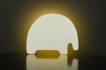 Canvas Print - Animal shaped glowing night lamp on black background