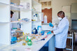 © marvent - African male technician prepping samples in a lab