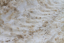 The Texture Of Dirty Snow On The Road With A Trail From A Bulldozer