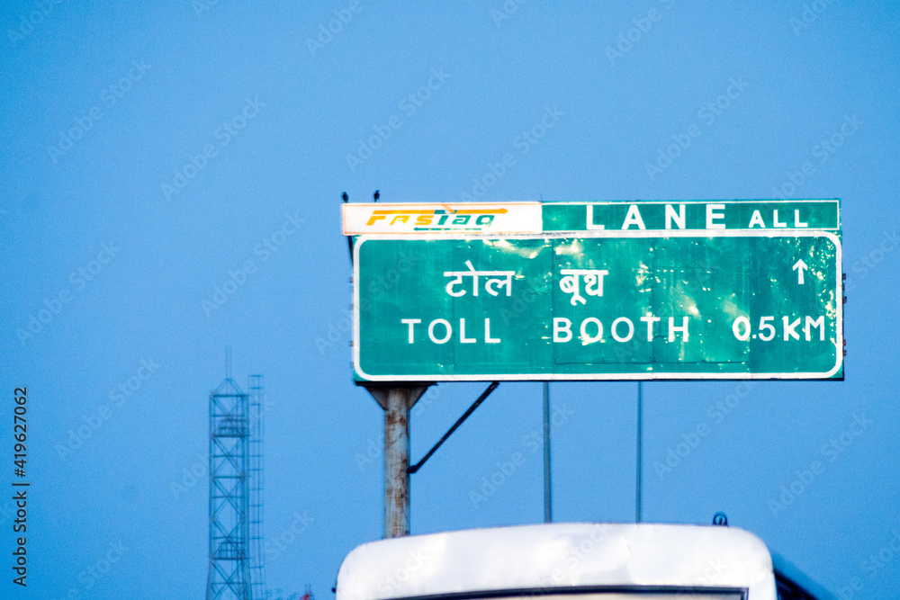 Toll booth sign near a toll booth showing the new cashless RFID based ...