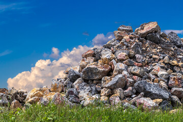 Wall Mural - View of granite heaps and sky clouds.