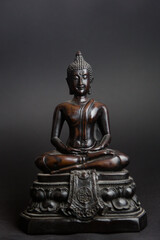 statue of wooden buddha, showing peace and serenity