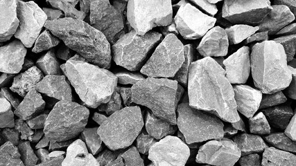  grey and yellow gravels background, Construction materials granite stones texture close up. black and white.