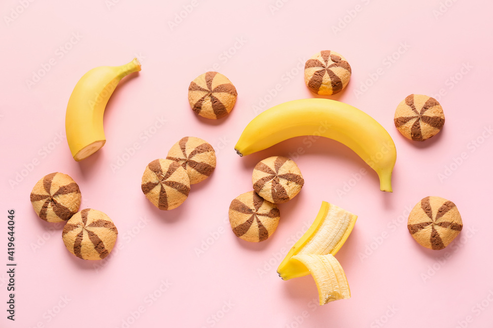 Composition with tasty cookies and bananas on color background