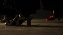 Group Of Womens Shoe Closeup Tap Dancing On A Lightly Illuminated Floor