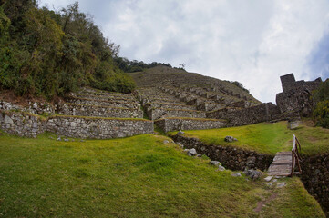 Poster - Bridge over stream in front of ancient Inca ruins in Peru 