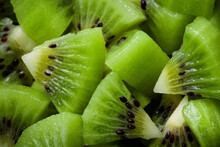 Macro View Of Chopped Fresh Kiwi Fruit. Cut Kiwifruit Close-up Background Texture Pattern.