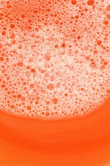 soap foam  on orange background. Beauty and hygiene concept.soap foam macro background.soap bubbles.Bath foam