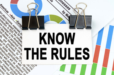 Among the reporting charts and diagrams is a plate with the inscription - KNOW THE RULES