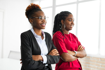 Sticker - two beautiful african young women in the office 