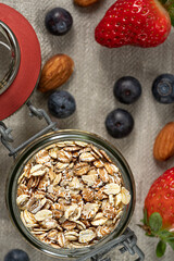 Healthy breakfast cereal oat- flakes with fresh berries  and almond.