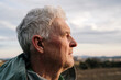 © VITTA GALLERY/Westend61 - Senior man with wrinkled face against cloudy sky looking away