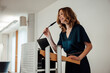 © Joseffson/Westend61 - Smiling businesswoman giving presentation speech in office