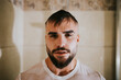 © Miguel Frias/Westend61 - Bearded wet man with t-shirt taking shower in bathroom at home