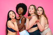 © OneInchPunch/Westend61 - Multi-ethnic group of female models in lingerie blowing kisses against pink background