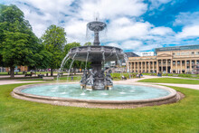 Germany, Baden-Wurttemberg, Stuttgart, Ornate Fountain At Schlossplatz Square With Konigsbau In Background
