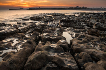 Wall Mural - beautiful dramatic sunset in the shores of Swansea,Wales