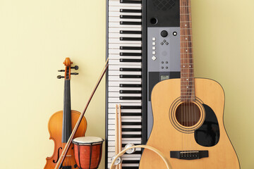 Different musical instruments on color background