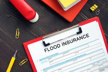 Conceptual photo about FLOOD INSURANCE Application Form with written phrase.