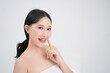 © PBXStudio - Youthful bright skin of a beautiful Asian woman is isolated from a white background. She was smiling and happy.