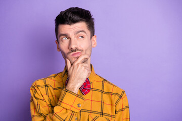 Sticker - Photo of doubtful uncertain young man wear plaid shirt bow tie arm chin looking empty space isolated violet color background