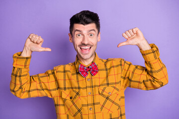 Poster - Photo of funky surprised young man wear plaid shirt bow tie pointing thumbs up himself isolated violet color background