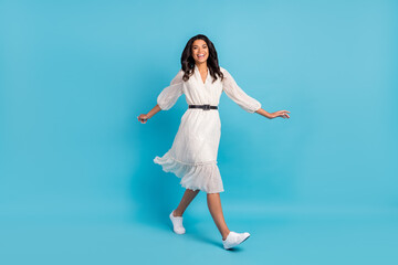 Sticker - Full length body size view of attractive glad cheerful girl wearing midi dress going isolated over bright blue color background