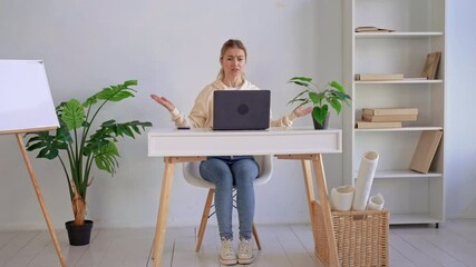 Poster - portrait angry woman online negotiations using laptop for online meeting at home office freelancer in casual hoodie