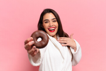 Wall Mural - young pretty hispanic woman. happy and surprised expression. breakfast concept