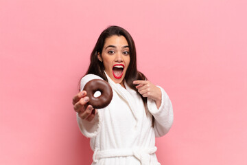 Wall Mural - young pretty hispanic woman. shocked or surprised expression breakfast concept