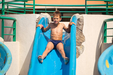 children swim in a pool with blue water