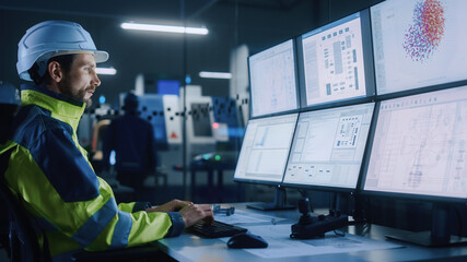 Leinwandbilder - Industry 4.0 Modern Factory: Facility Operator Controls Workshop Production Line, Uses Computer with Screens Showing Complex UI of Machine Operation Processes, Controllers, Machinery Blueprints