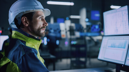 Leinwandbilder - Industry 4.0 Modern Factory: Portrait of Facility Operator Controls Workshop Production Line, Uses Computer with Screens Showing Complex UI of Machine Operation Processes, Controllers
