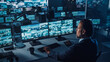 © Gorodenkoff - Male Officer Works on a Computer with Surveillance CCTV Video Footage in a Harbour Monitoring Center with Multiple Cameras on a Big Digital Screen. Employees Sit in Front of Displays with Big Data.