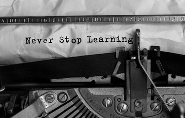 Wall Mural - text never stop learning typed on retro typewriter