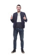 © ASDF - attractive young man in jeans showing thumbs up.
