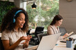 © Vergani Fotografia - black business woman in online meeting in office workspace. .